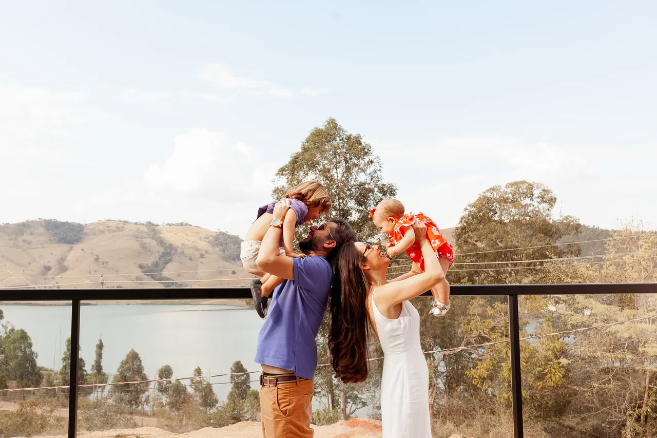 Family at Bellville Pousada, with Lake Furnas in the background