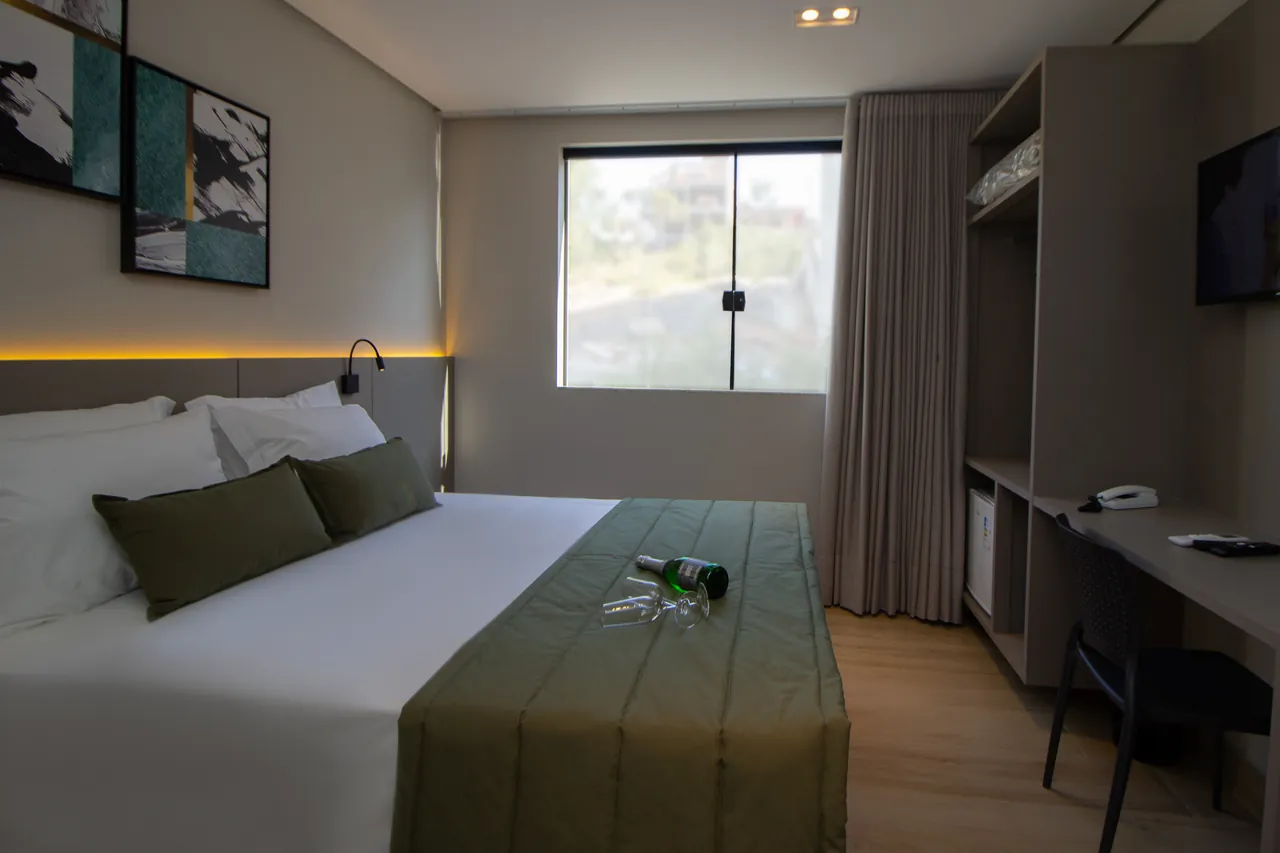 Room in the Luxo Suite, with a desk and window
